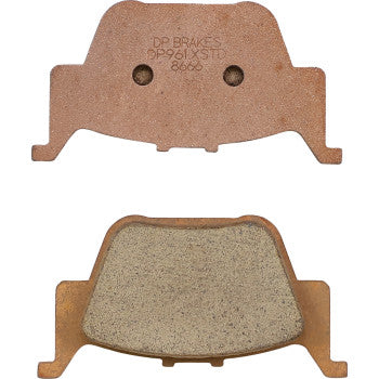 Two views of Honda Standard Brake Pads by Dp Brakes: the top view reveals the engraved flat back, while the bottom view highlights the textured friction surface of these premium sintered metal ATV brake pads.