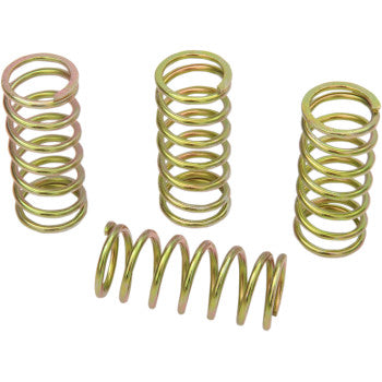 Four gold-toned metal coil clutch springs with tight, uniform winding and varying heights arranged on white background.