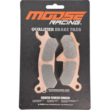 Front left brake pad in light copper color with textured gray friction surface, designed for offroad use by Moose Racing.