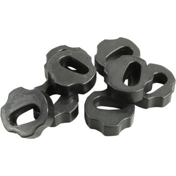 A group of black metal weights with rounded edges, like those found in the Cushion Kit by Hinson Racing, are stacked and overlapping each other on a white background.