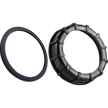 The Polaris Replacement Fuel Pump Nut and Gasket by Quad Logic includes a thin black gasket and a thicker grooved nut, shown on a white background—perfect for replacing your Polaris fuel pump’s nut or retainer.