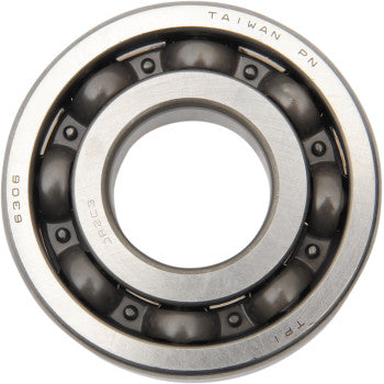 A close-up view of a Yamaha Crankshaft Bearing by Hot Rods, showing visible ball bearings inside and "TAIWAN PN 6306" engraved on its outer ring.