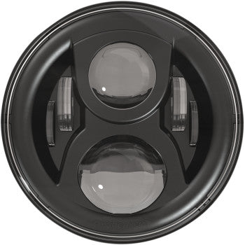 Close-up of the J.W. Speaker Headlight with Mounting Ring - Black, a 7 automotive LED headlight featuring Dual-Burn technology, two central lenses, and vertical side lights in a circular housing.