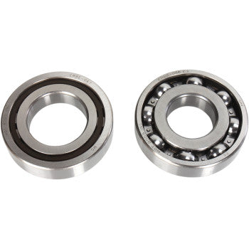 Two circular metal crankshaft bearings, one sealed with a black rubber ring, the other open showing steel ball bearings.