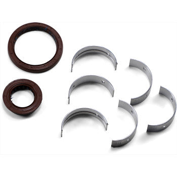 Set of metal half-circle crankshaft main bearings with brown rubber oil seals on a white background.