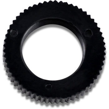 Black circular choke cable nut with fine ridged edges and three small screw holes.