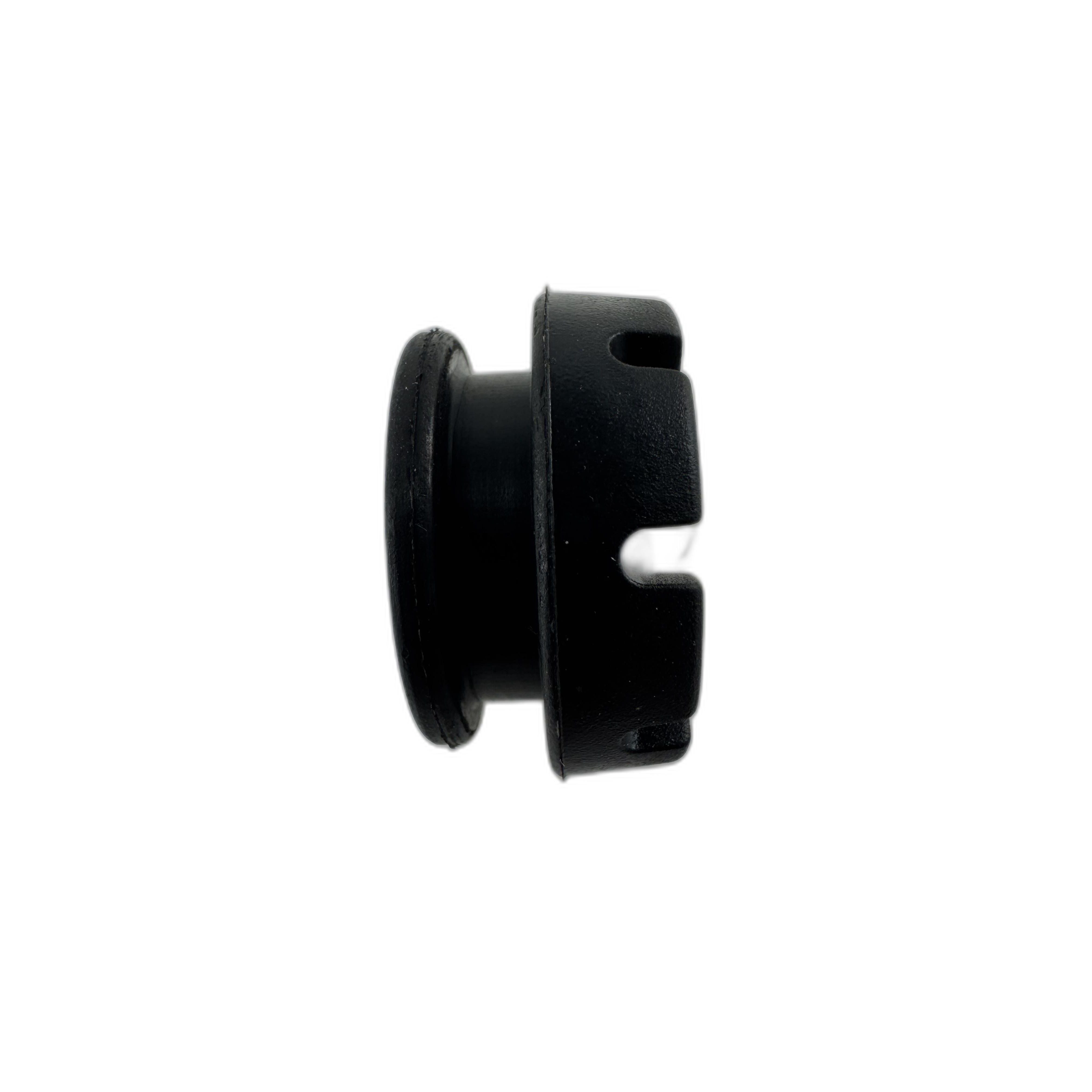 The Latch Grommet by Polaris is a black cylindrical plastic part with a raised edge on one end and two wide rectangular slots on the other, shown from the side and compatible with Polaris ATV and UTV models, isolated on a white background.