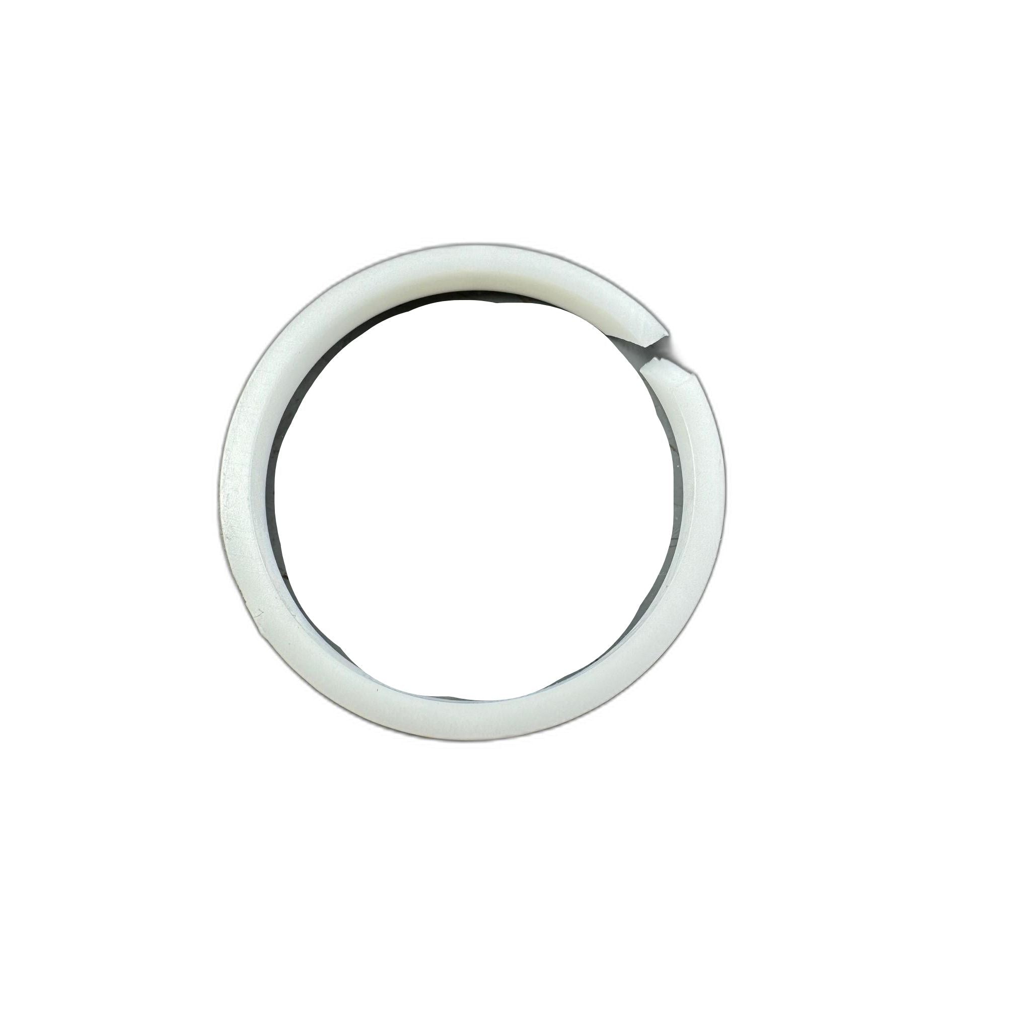 A round, scratched metallic disc—likely part of the Kit, Piston Ring by Polaris—is partly encircled by a white plastic ring with a small gap, both items displayed on a plain white background.