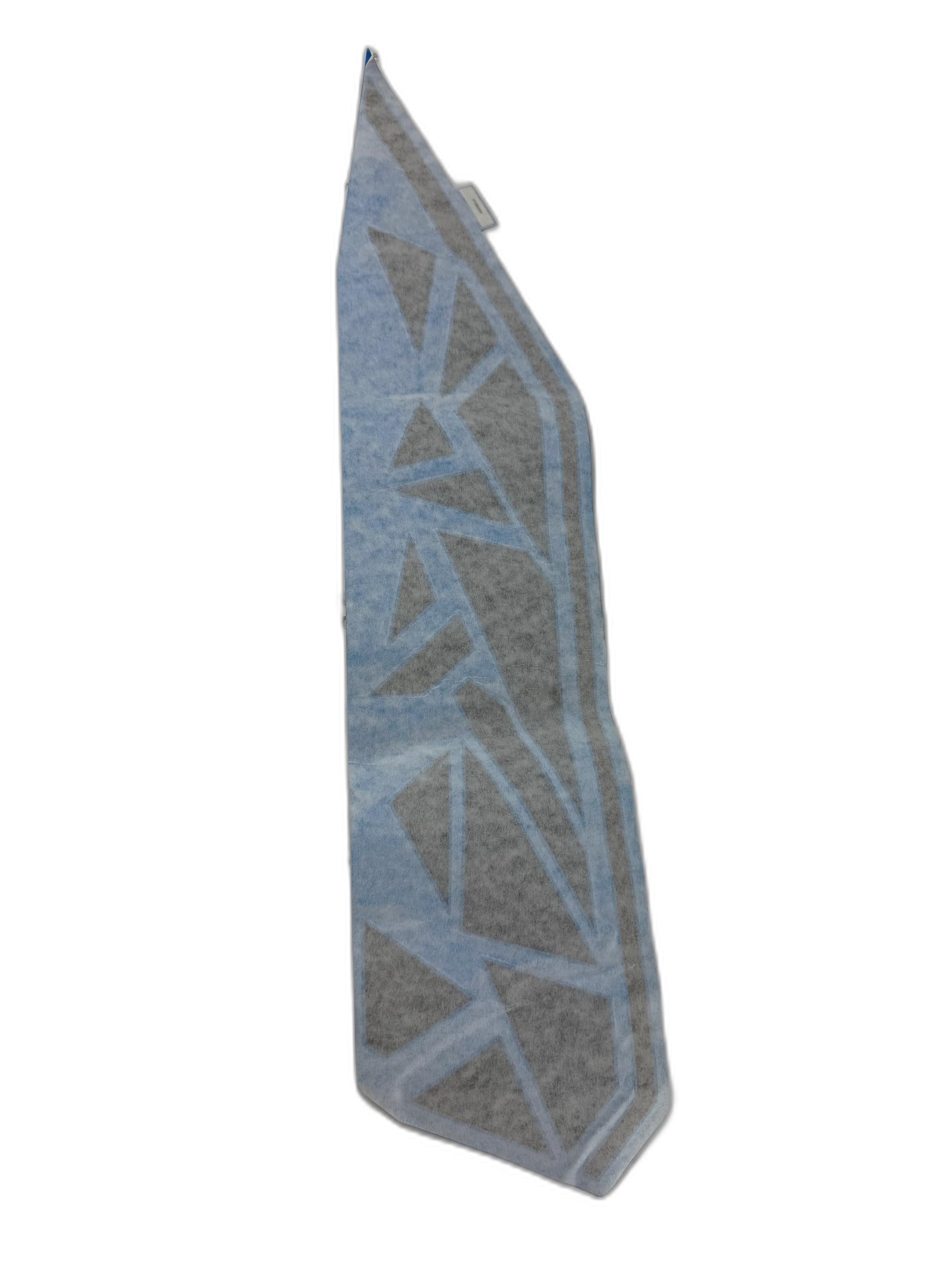 A triangular gray towel with light blue geometric patterns—its sharp angles evoke the style of the Polaris Decal-Door,Frt,Lh—laid flat on a white background.