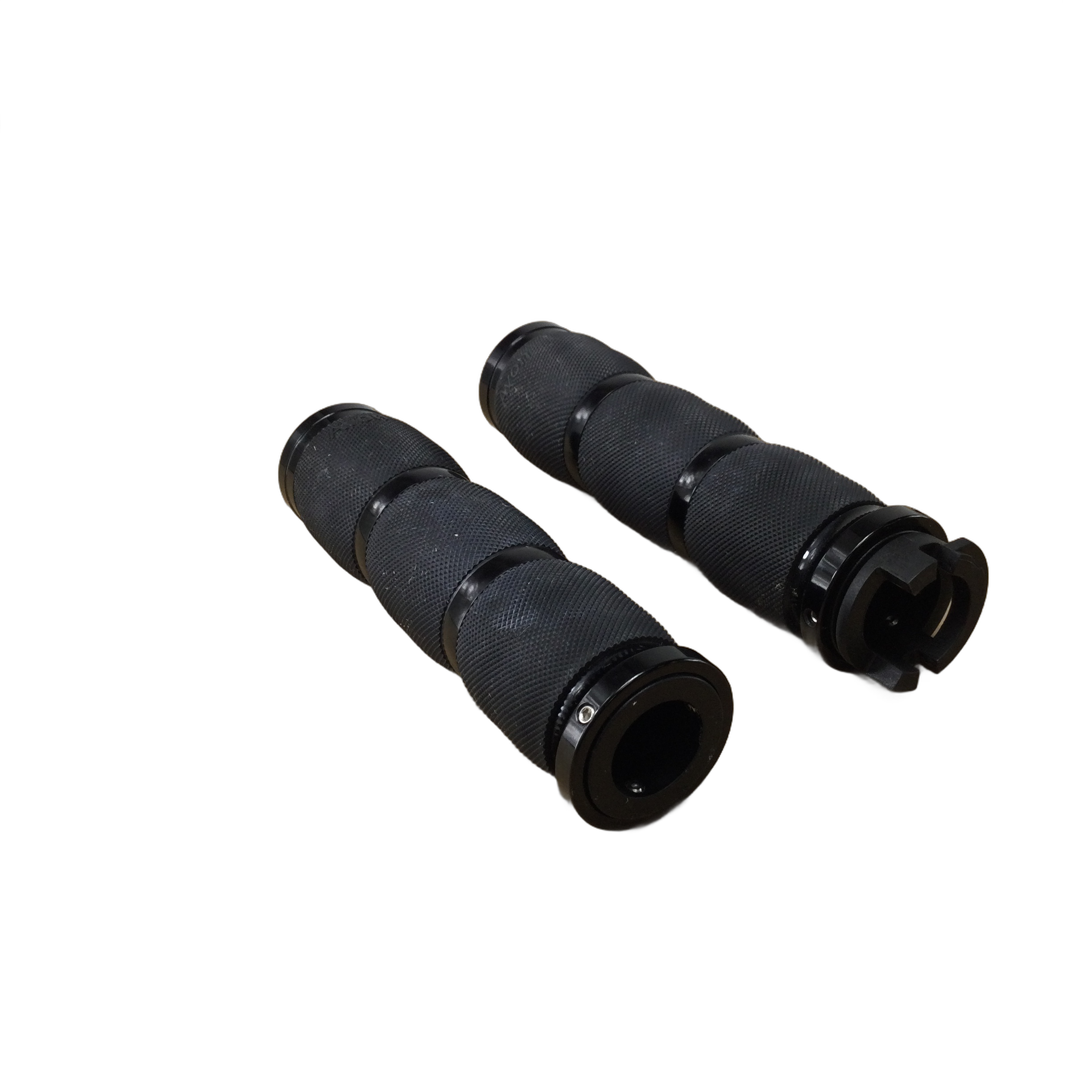 Two black textured Indian Scout Air Cushioned Anodized grips with throttle boss by Avon Grips are shown on a white background, one displaying the end cap and the other the open end—ideal for customizing your Victory motorcycles.