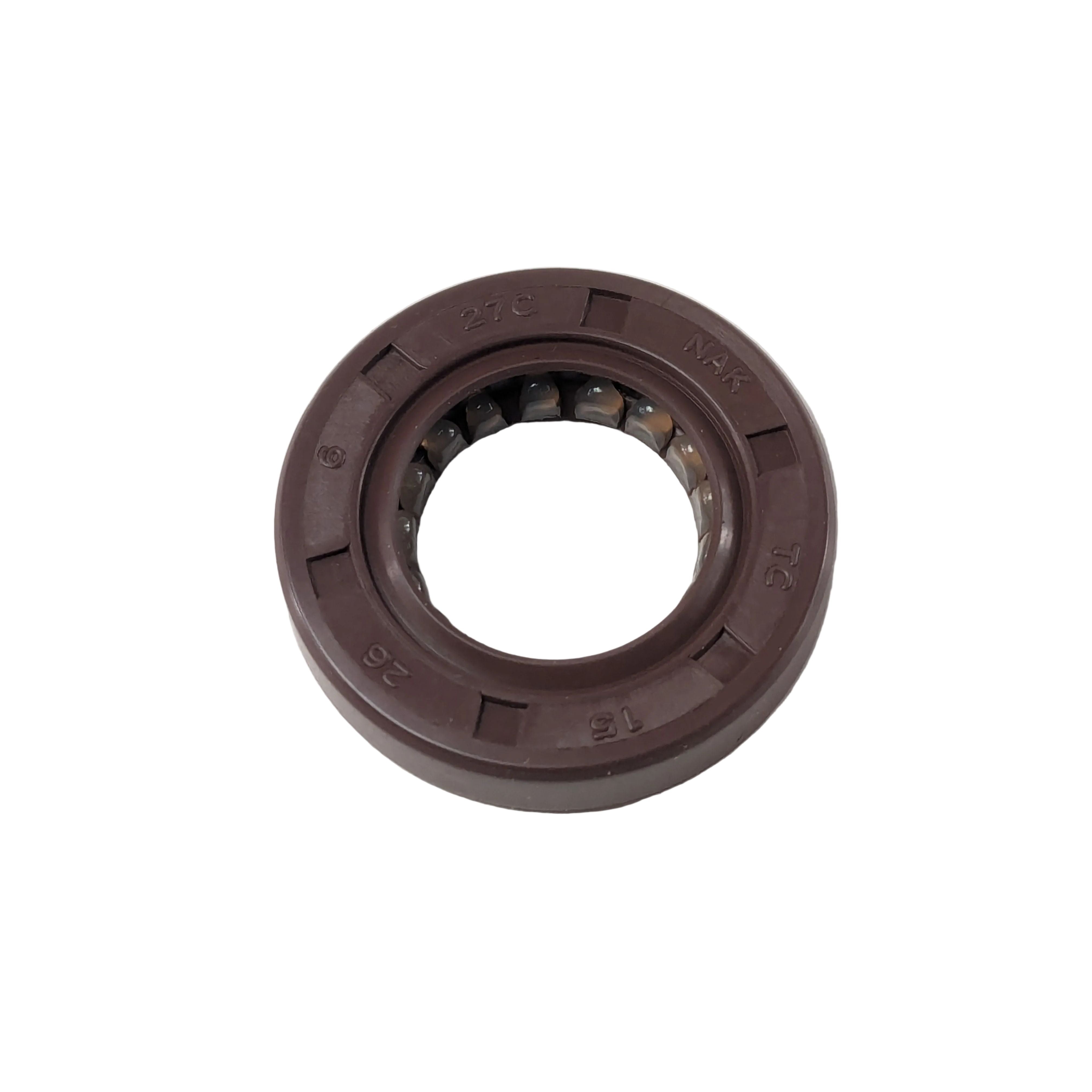 Brown rubber oil seal with inner metal spring ring, circular with a hollow center, size 15x26x6mm.