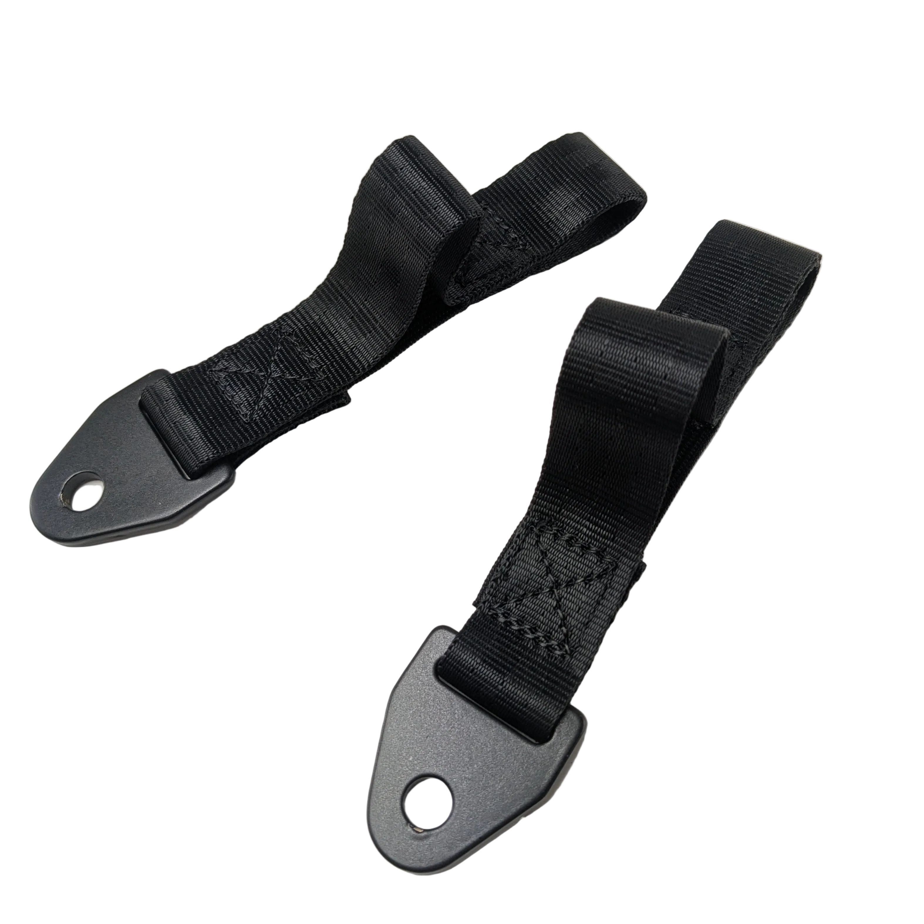 Black nylon door straps with metal mounting tabs featuring circular holes for attachment.