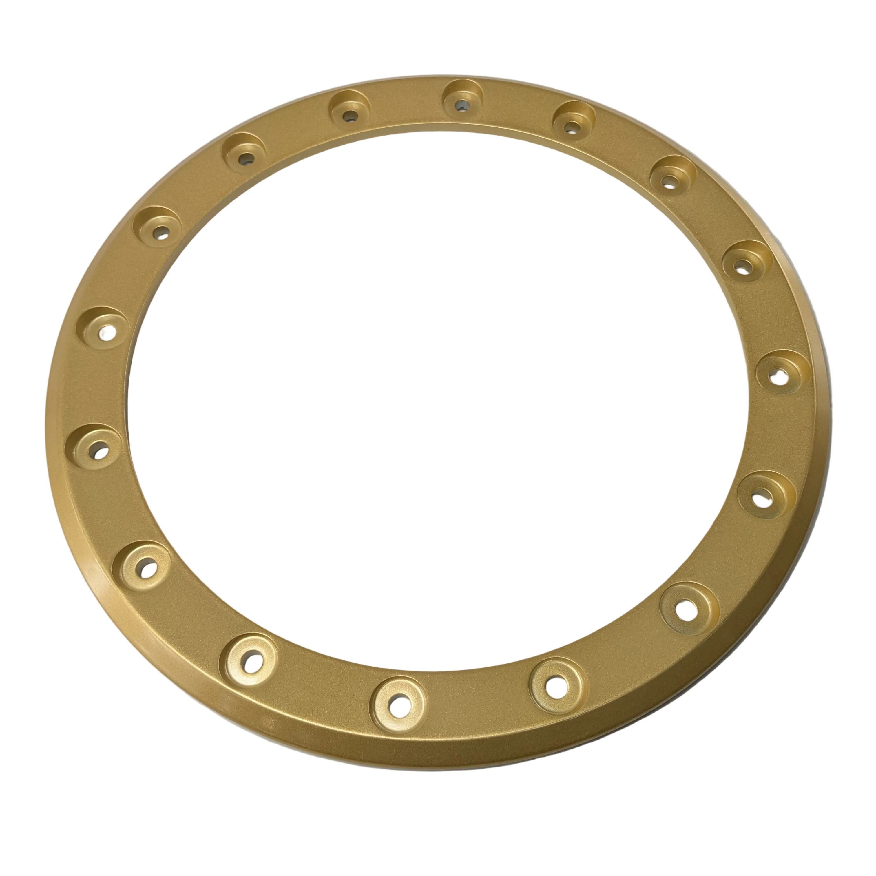 Gold-colored circular reinforcement disk with evenly spaced bolt holes around the perimeter.