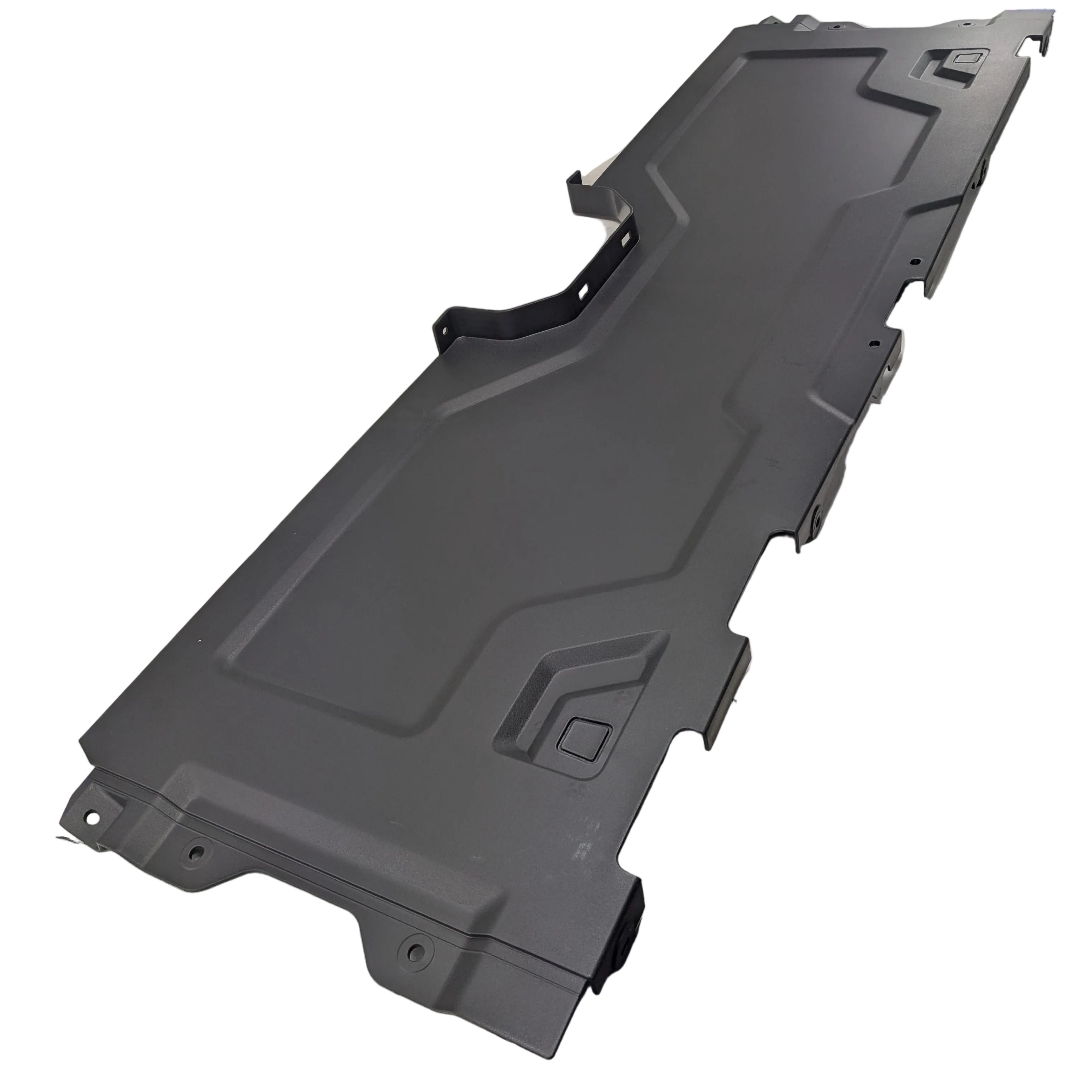 Matte black molded plastic front lower baffle seat panel with angular contour lines and mounting tabs.