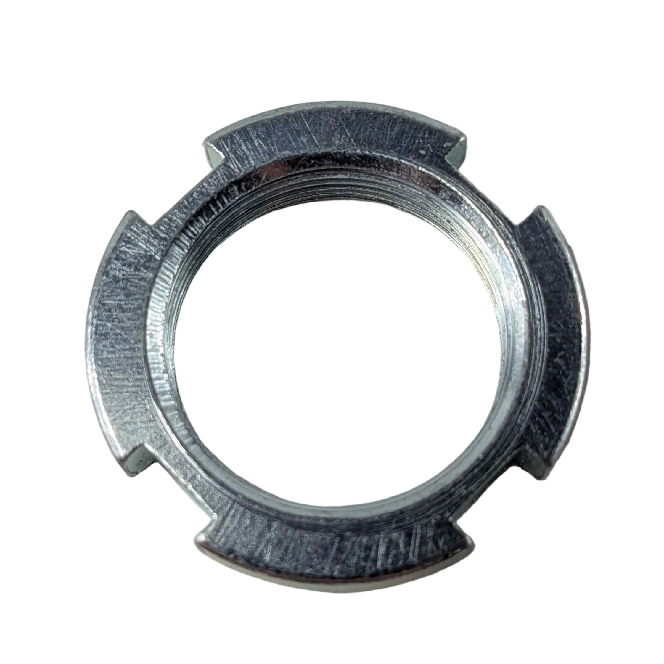 Silver metal locking nut with three notches and engraved markings on the outer edge.
