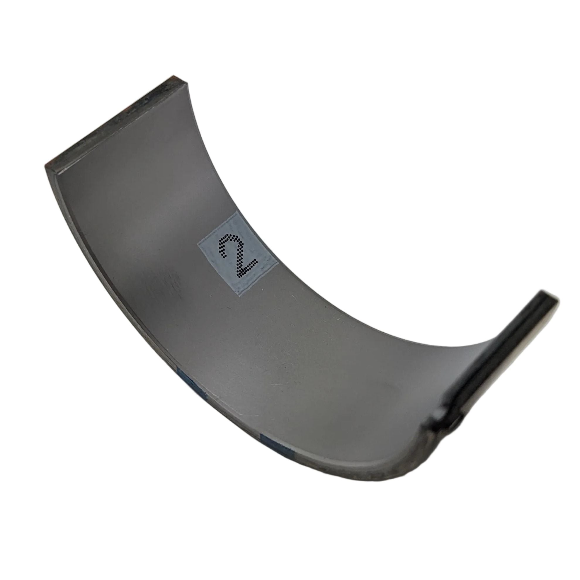Curved silver metal lower grade 2 bearing main part with small tab on edge.