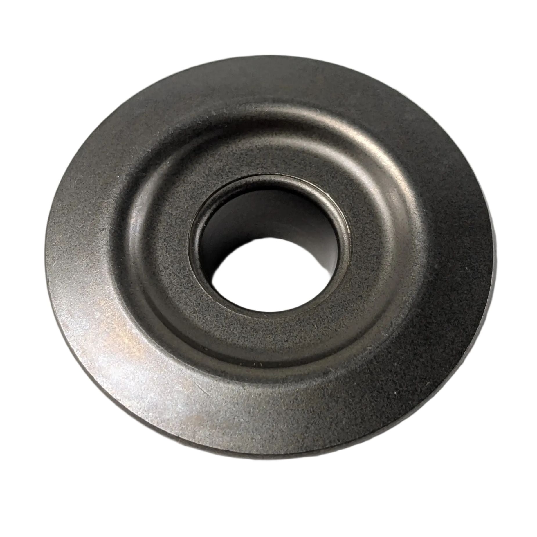 Round metal valve spring retainer with a central hole and smooth finish.