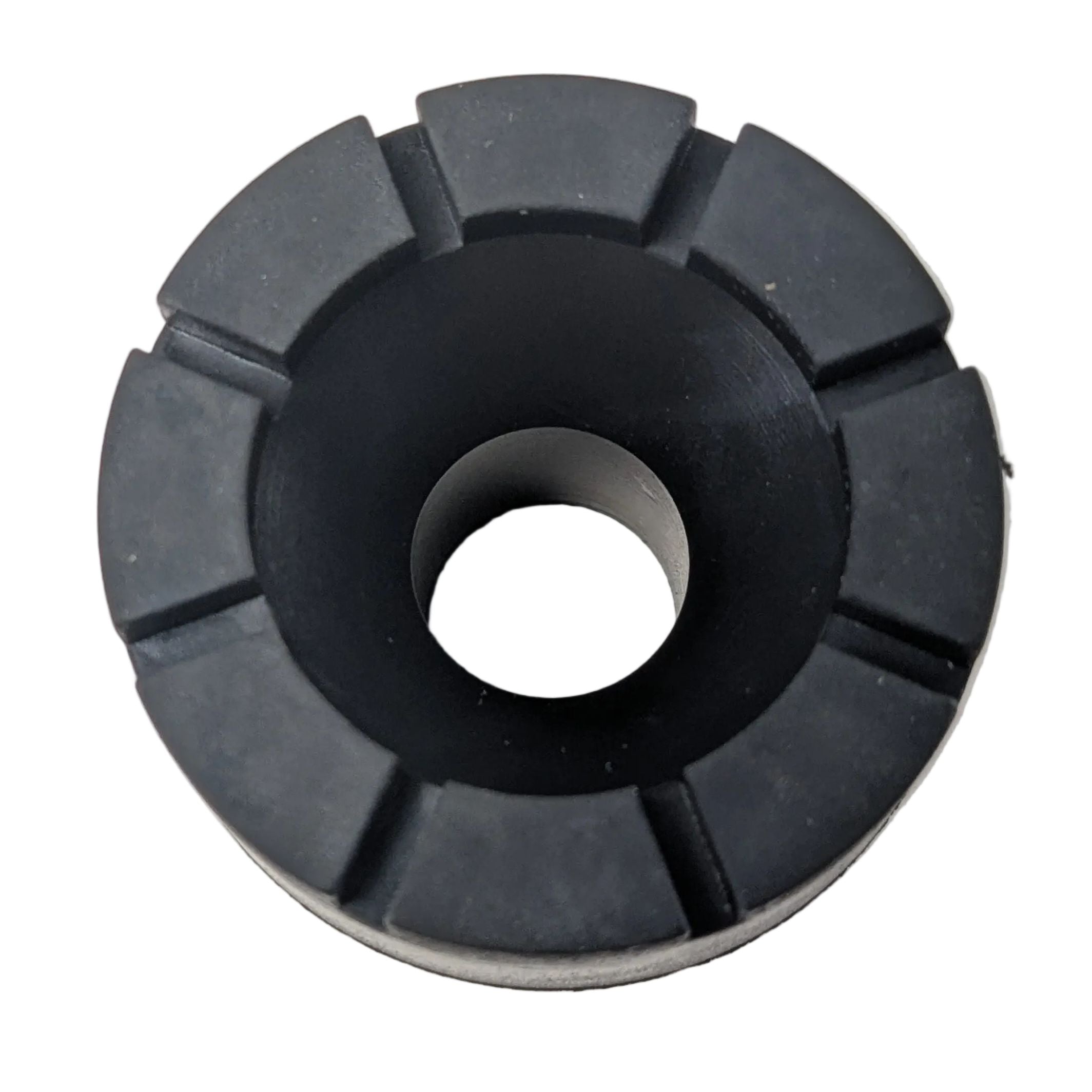 Black rubber seat grommet with segmented outer edge and hollow center hole.