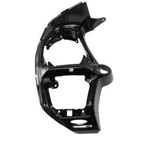 Black plastic motorcycle dash panel with angular lines and mounting points.