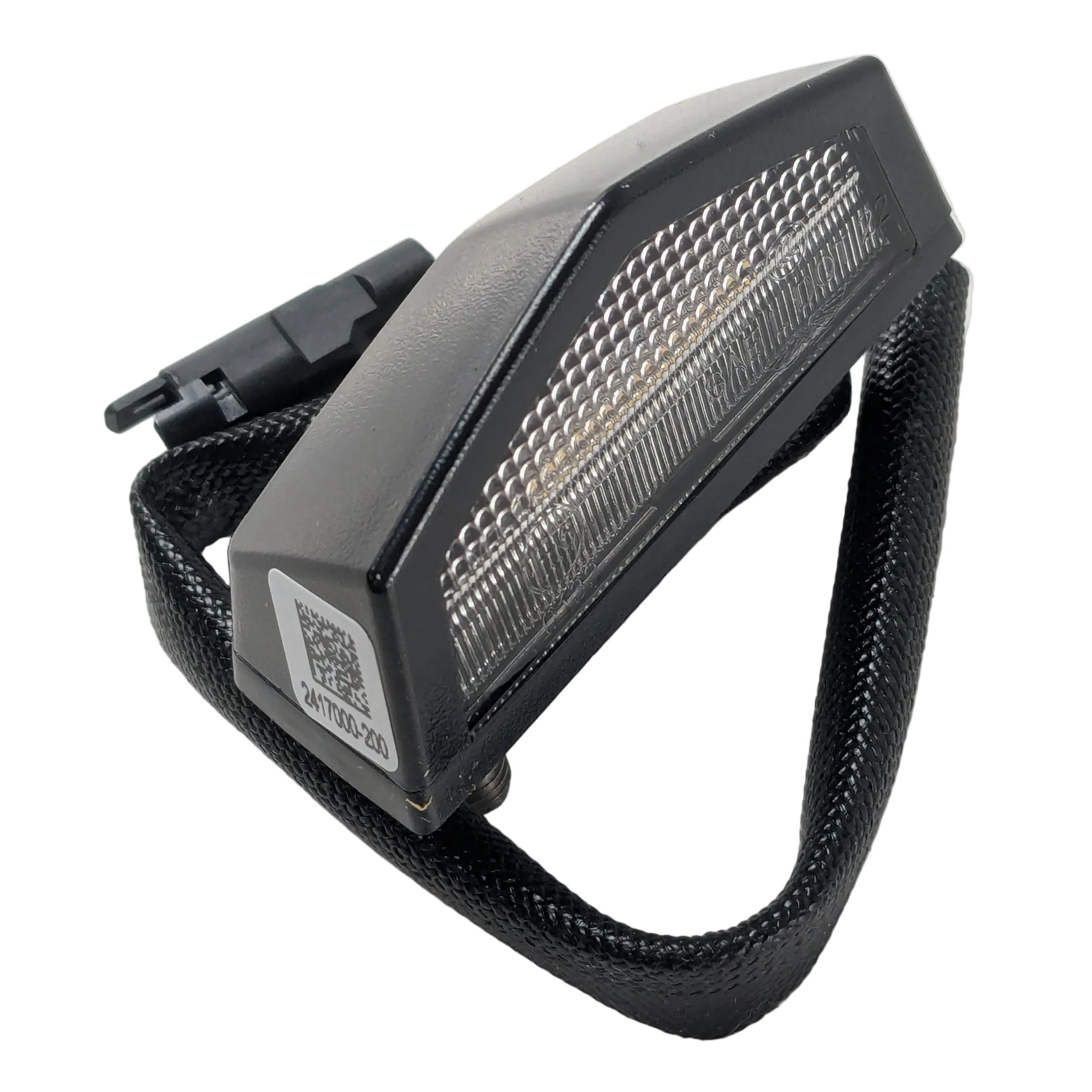 Black angular motorcycle license plate light with clear lens and attached wiring harness.