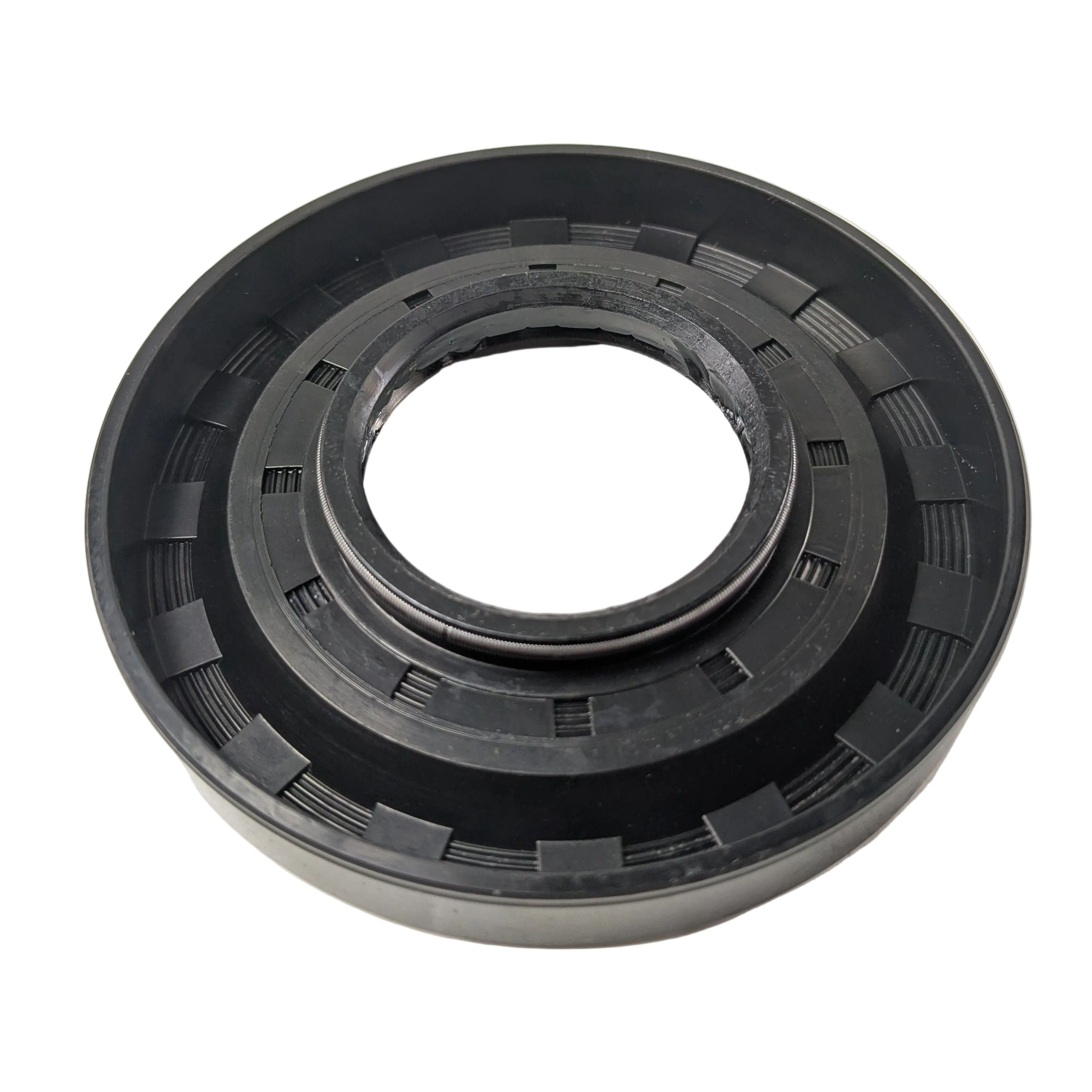 Black circular oil seal with grooved outer edge and central hole, made of rubber and metal components.