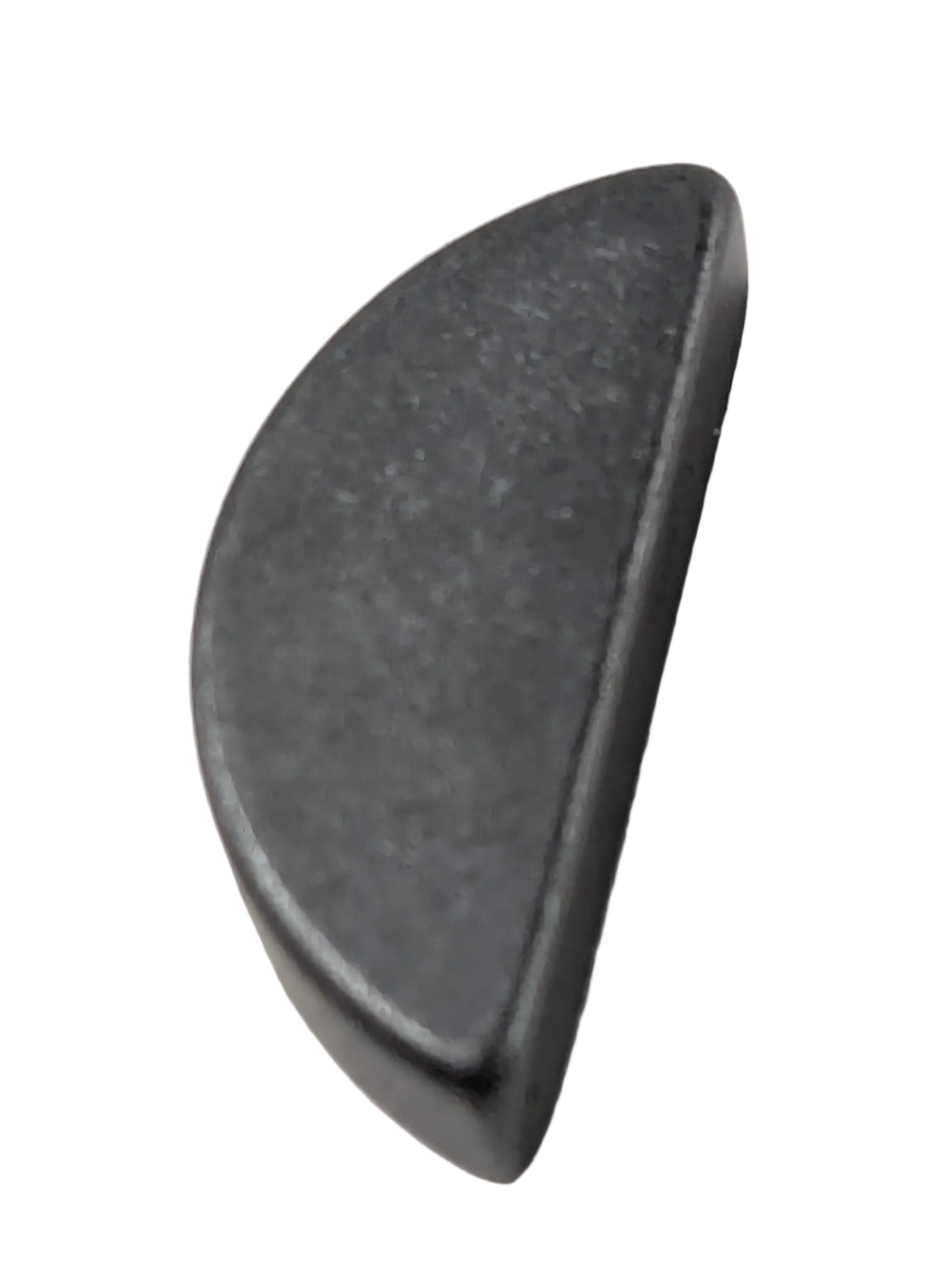 Small black semicircular metal key woodruff for Kawasaki vehicles on white surface.