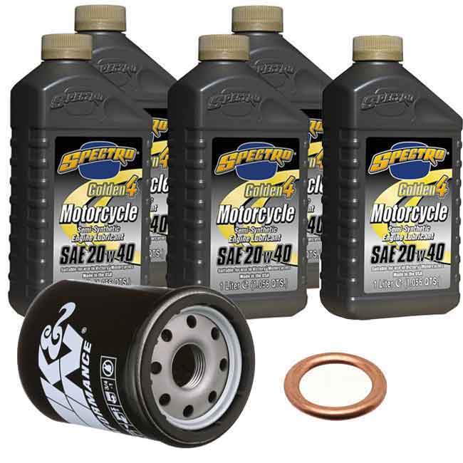 Three black 5.28 qt bottles of Spectro Golden 4T synthetic 10W-40 motorcycle oil, black K&N oil filter, and copper crush.