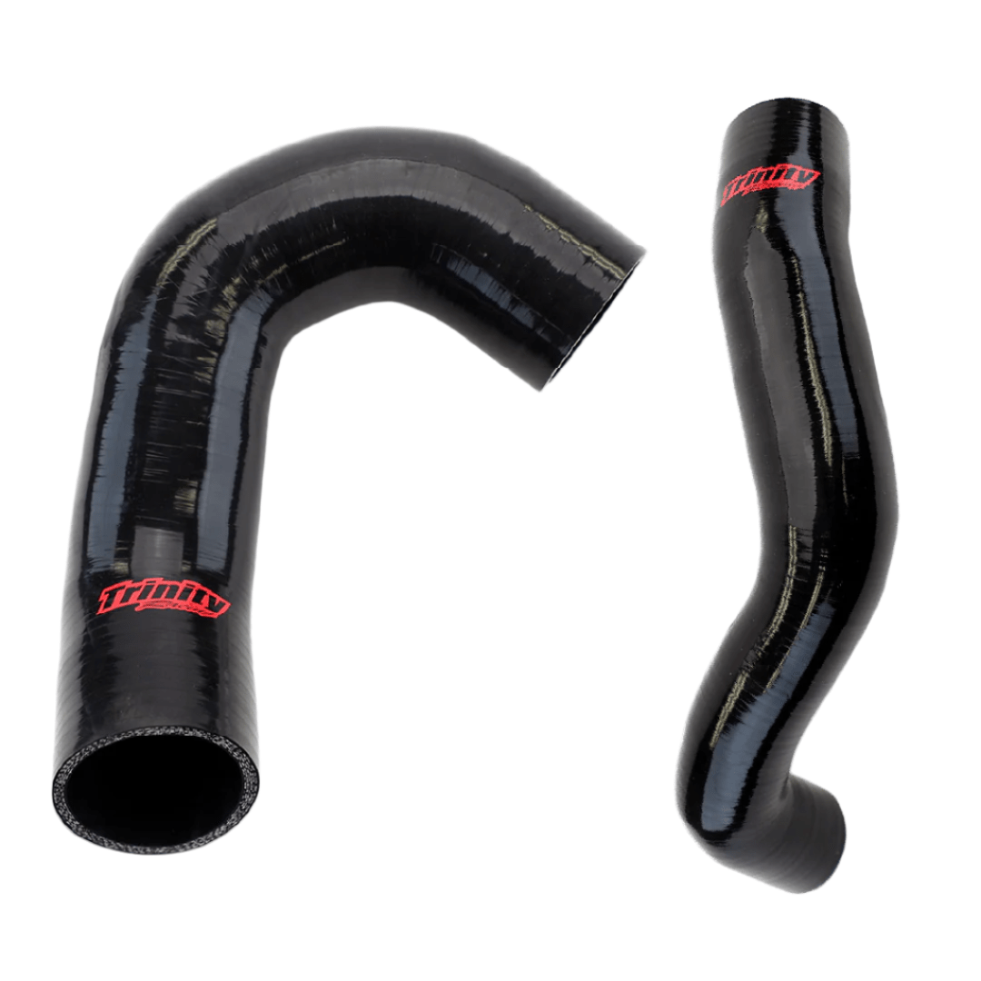The Maverick R Charge Tubes by Trinity Racing—two black, glossy silicone tubes with red logos, shaped L and curved—are shown on a white background.