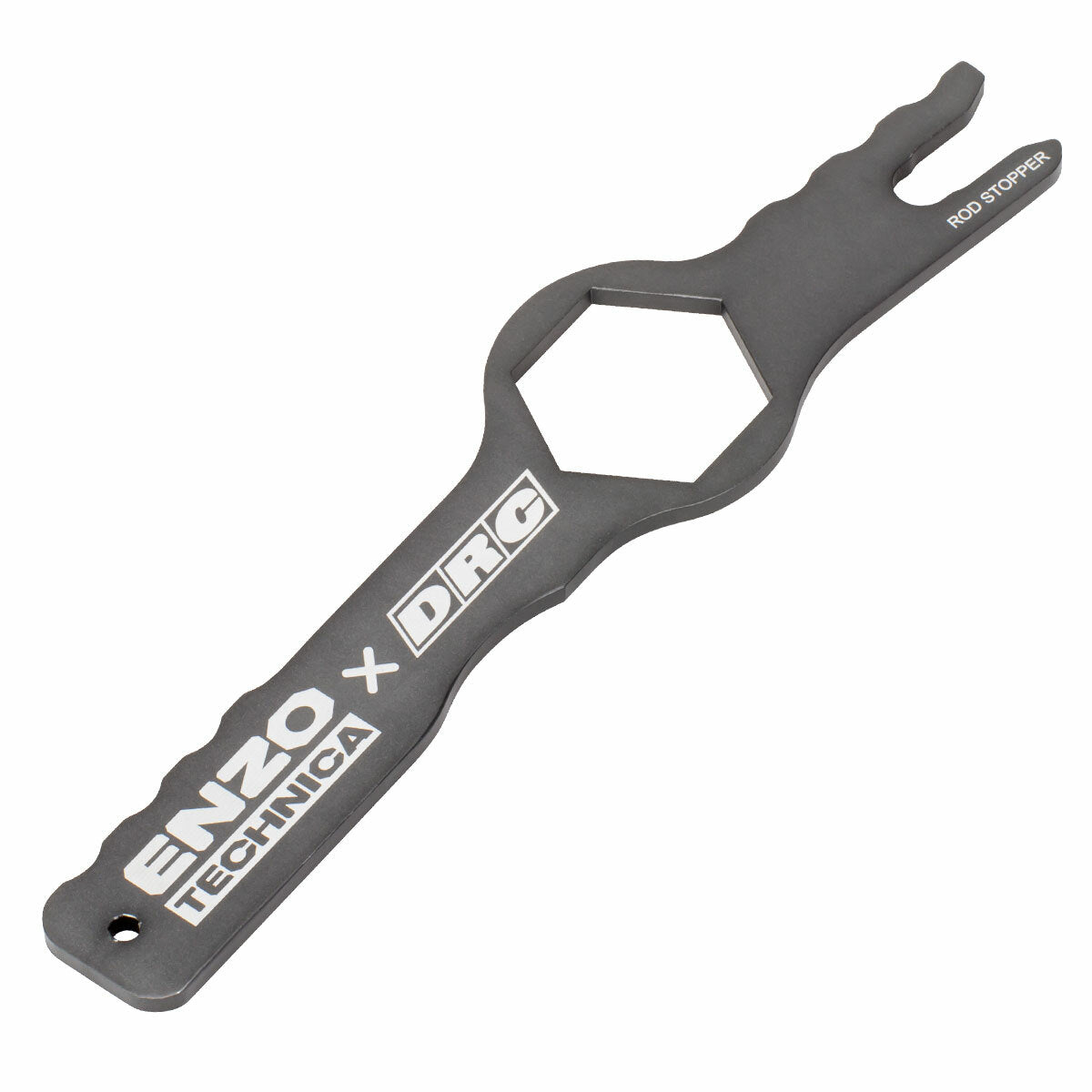 A black metal Fork Cap Spinner by DRC, featuring a hexagonal center, ergonomic grooved handle for grip, notched tip labeled ROD STOPPER, and branding "ENZO TECHNICA x DRC.