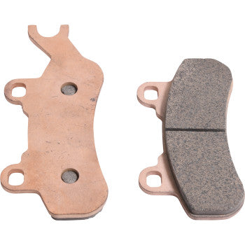 The Sintered Brake Pads by All Balls are shown: one displays a smooth friction surface, the other reveals a metal backing plate with three holes. Both feature irregular shapes, several mounting points, and deliver excellent stopping power.