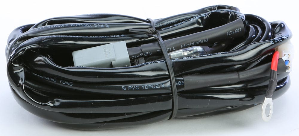 The Light Bar Wire Harness 3 Pod by Open Trail is a coiled black cable with multiple connectors, including a gray rectangular plug and a metal ring terminal, secured with a twist tie.