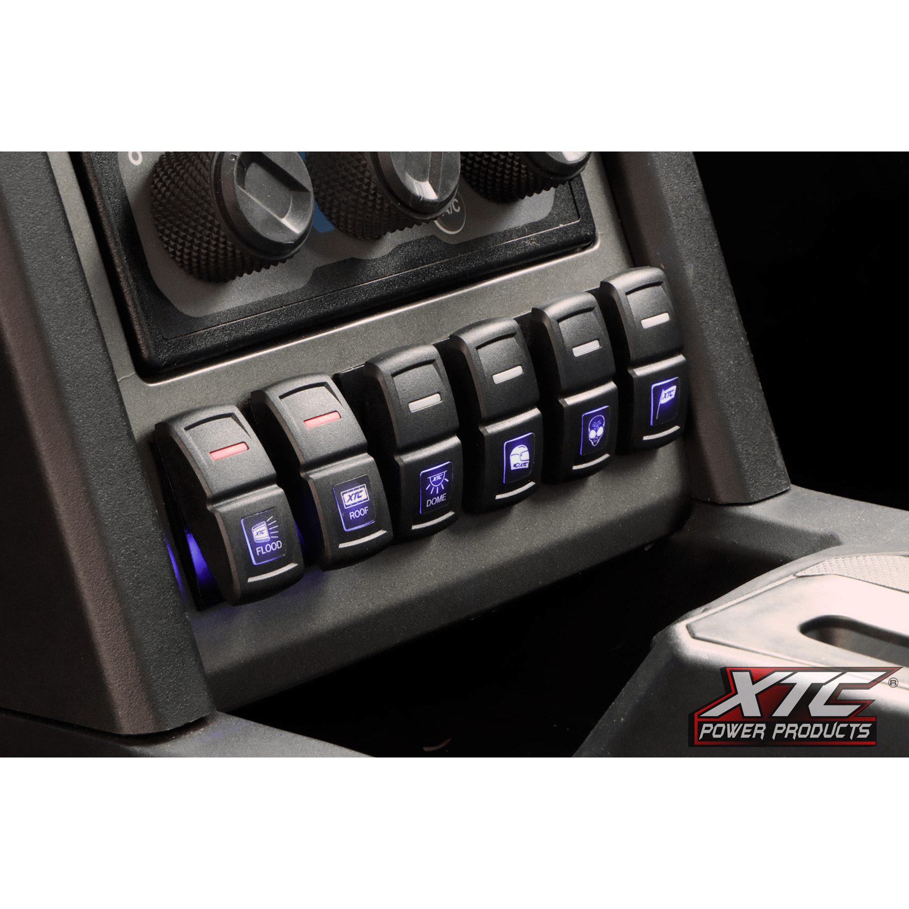 Close-up of the Light Duty Switch System In Cab Pulse Bar 4-Pack by XTC Power, designed for UTV wiring—features six blue-lit rocker switches for flood, dome, and fan functions, plus three round dials. Fits Polaris Ranger 1500.