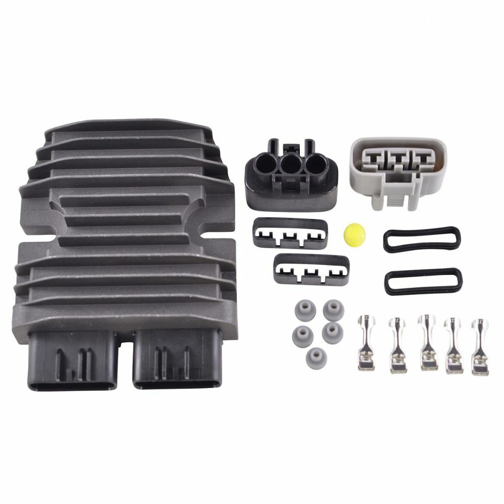 Gray finned metal regulator with two black connectors, multiple small gray and black plastic electrical components, and.