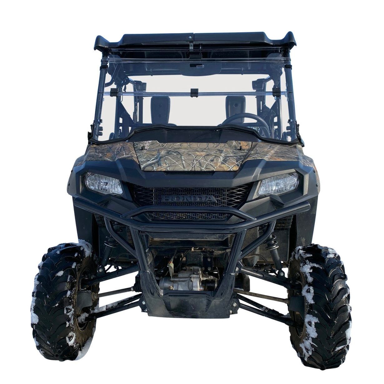 Front view of a UTV featuring a camo hood, black frame, large rugged tires, roll cage, and an Open Trail Folding Windshield for optimal visibility, photographed against a white background.