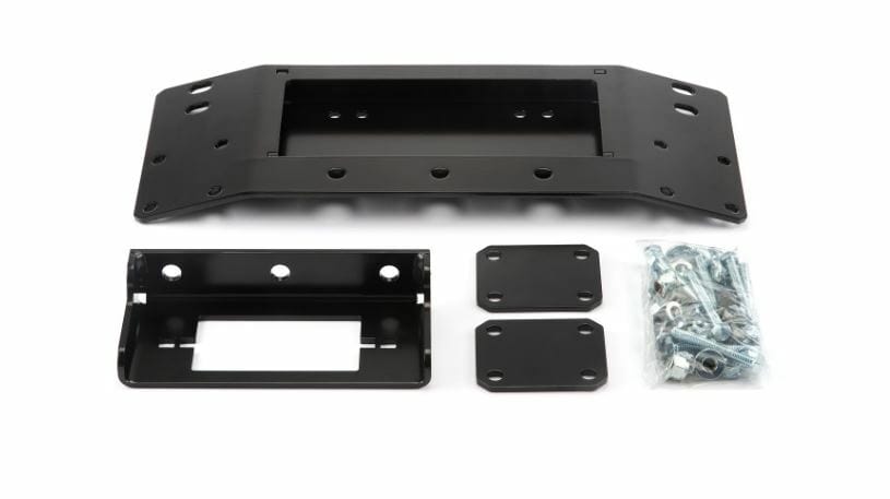 The Honda UTV Winch Mounting Kit by Warn includes a main bracket, rectangular bracket, two small plates, and assorted screws/bolts—black metal with corrosion resistance—ideal for engineers or ATV winch installs. Shown on a white background.