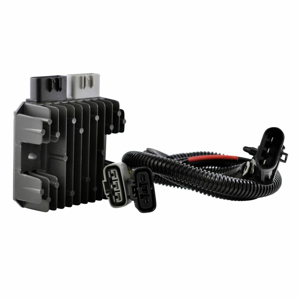 Black and silver offroad regulator with cooling fins and attached coiled wiring harness with connectors.