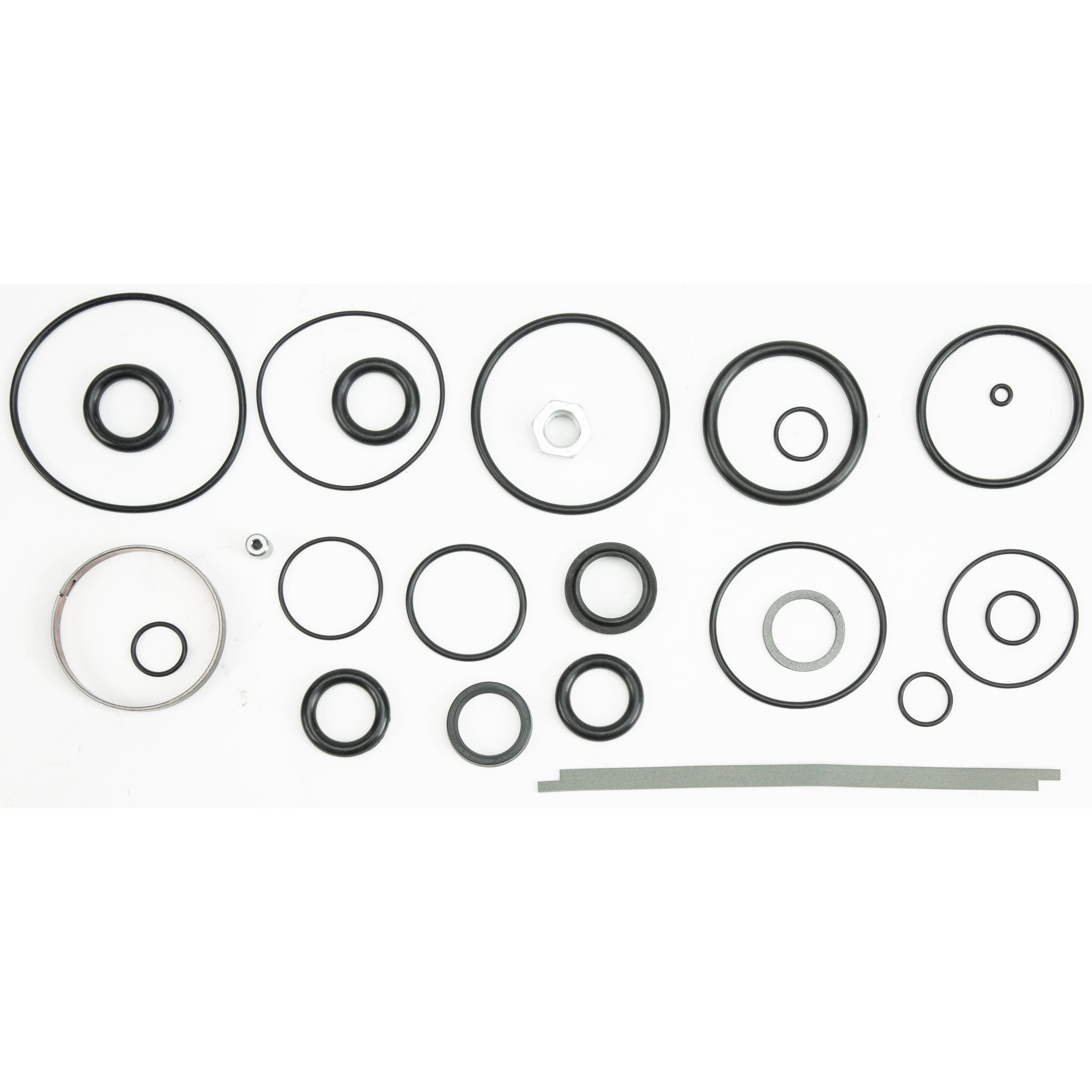 OEM Rear Bypass Rebuild Kit Replacement Parts by Fox, featuring black rubber o-rings, a metal washer, a hex nut, and two thin gray strips, are arranged neatly on a white background.