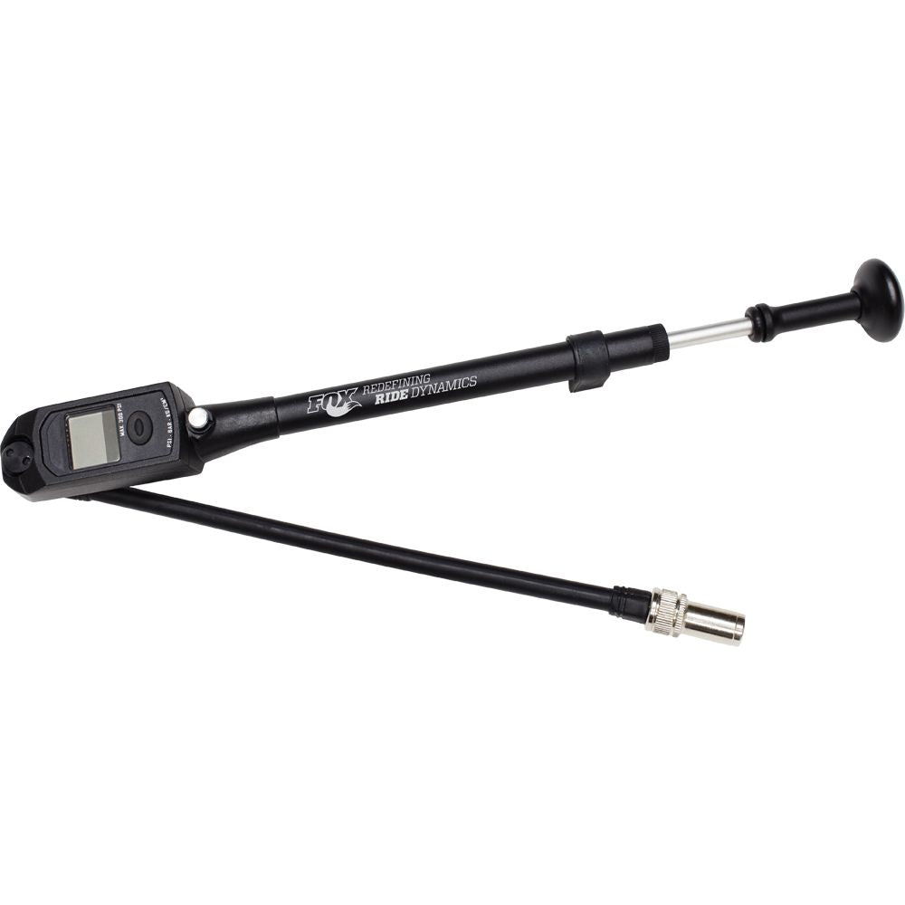 The Digital Shock Pump 0-300Psi by Fox features an LCD display, bleed valve, flexible hose, and metal nozzle for precise bike suspension air pressure adjustment. Labeled FOX High Pressure Ride Dynamics, it’s ideal for FOX FLOAT shocks.
