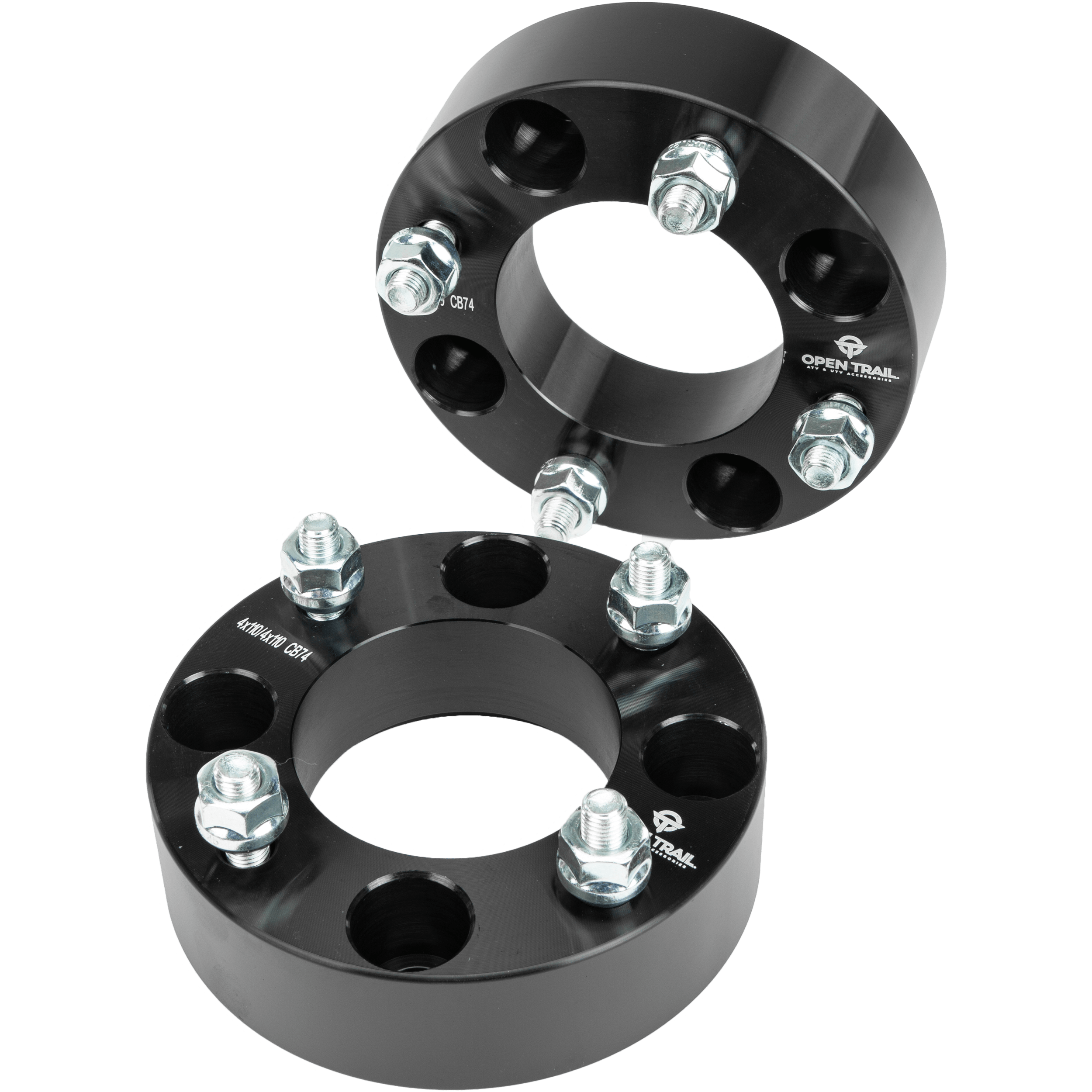 Two black Open Trail Wheel Spacer 1.5 4/110 Stud: 10mm x 1.25mm units—one upright, one flat—highlight their circular design and bolt holes for enhanced traction and stability.