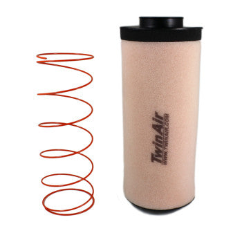 A Polaris Standard Air Filter with Cage by Twin Air, beige and cylindrical with bold branding, stands upright beside a coiled red wire spring on a white background.