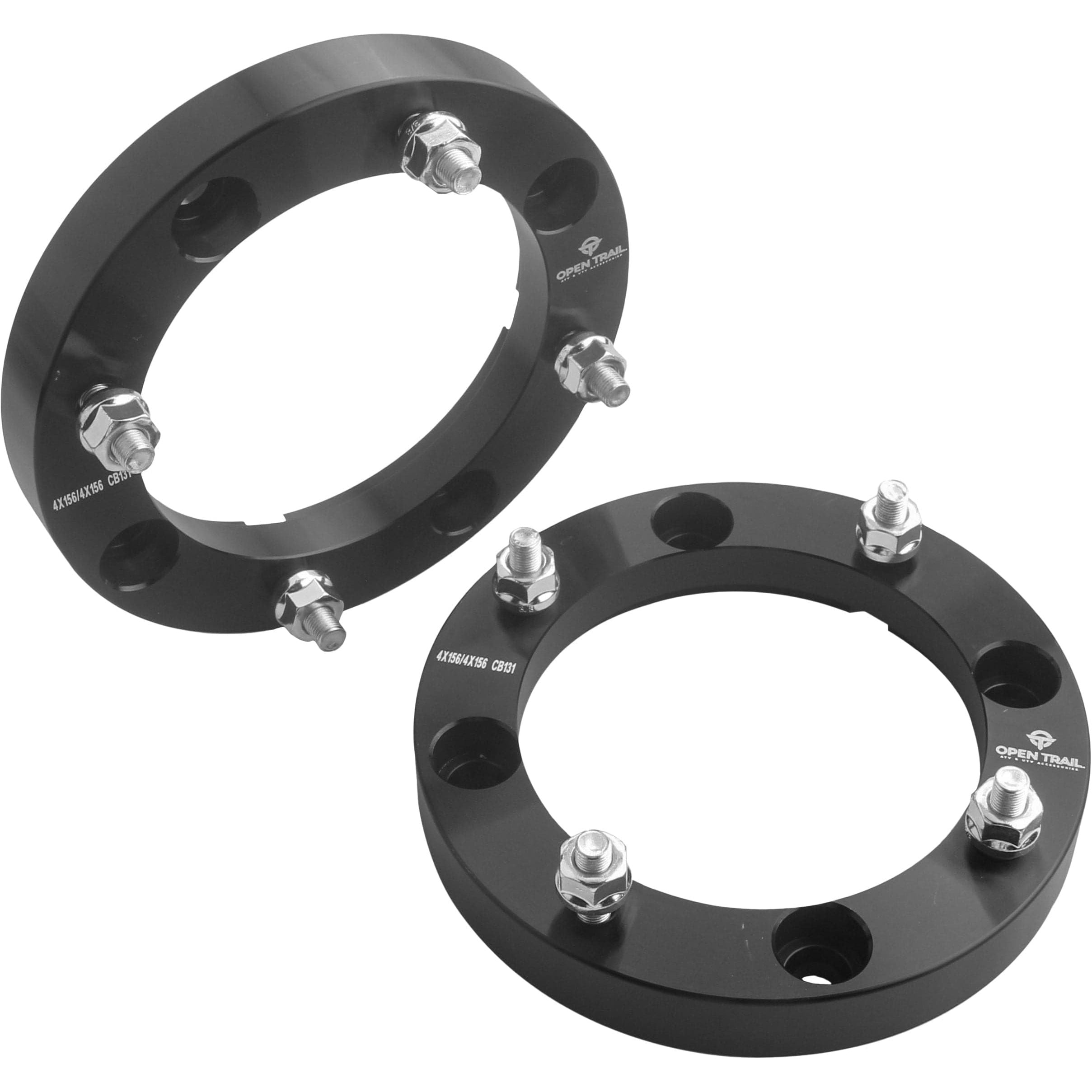 Two black Open Trail 1 wheel spacers (4/156, 10mm x 1.25mm studs) with four bolts each are shown on a white background, featuring circular designs with evenly spaced bolt holes and silver nuts for added clearance.