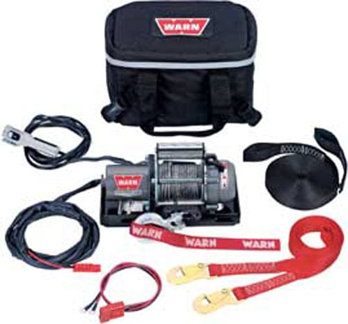 The Replacement Cable By Warn is shown with control cables, a red tow strap, black strap, power cables, and a black carrying case, all organized neatly on a white background.