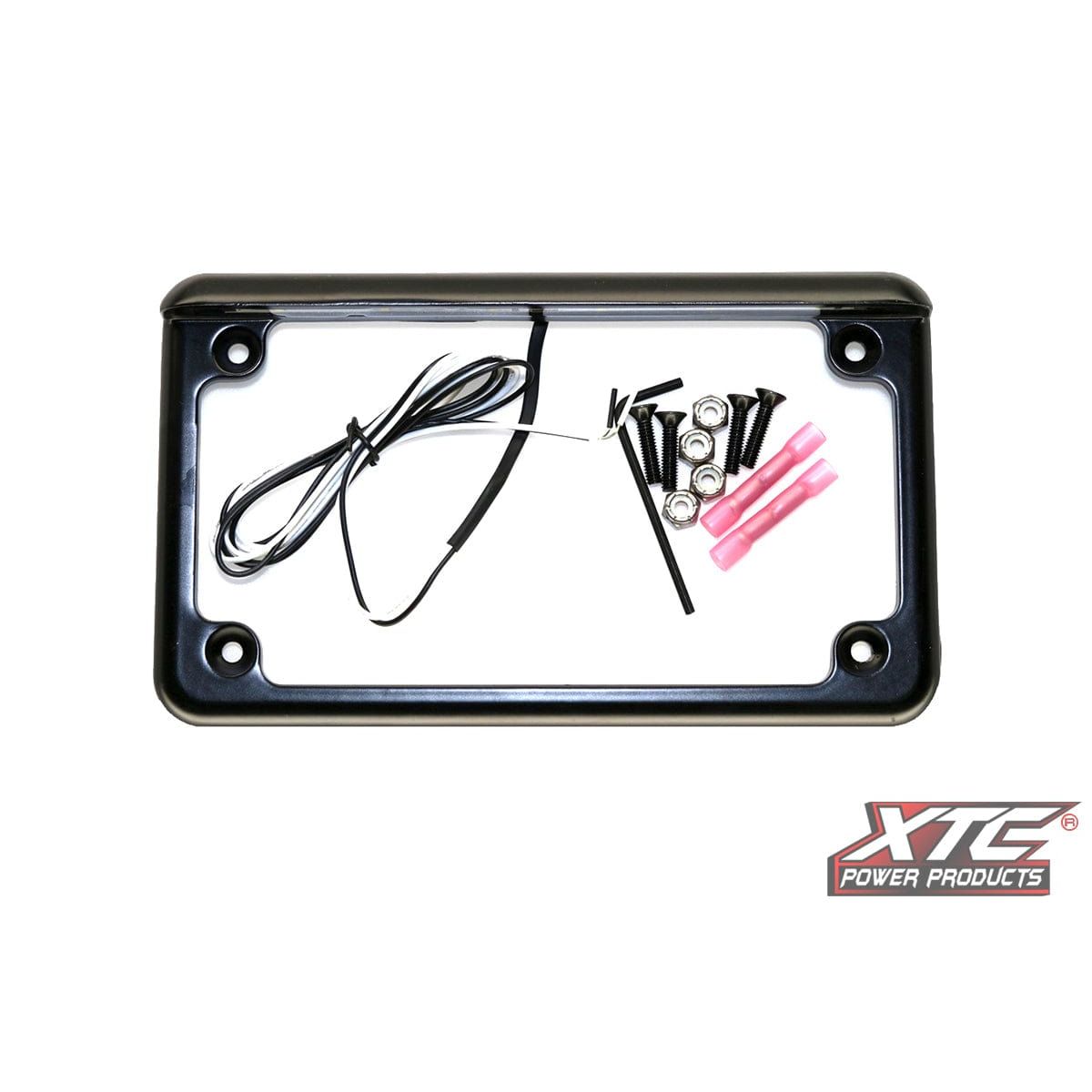 The License Plate W/ Led Universal By XTC Power features a black frame with white LEDs, the XTC Power Products logo in the bottom right corner, and includes mounting hardware: four screws, four nuts, and two pink wire connectors.