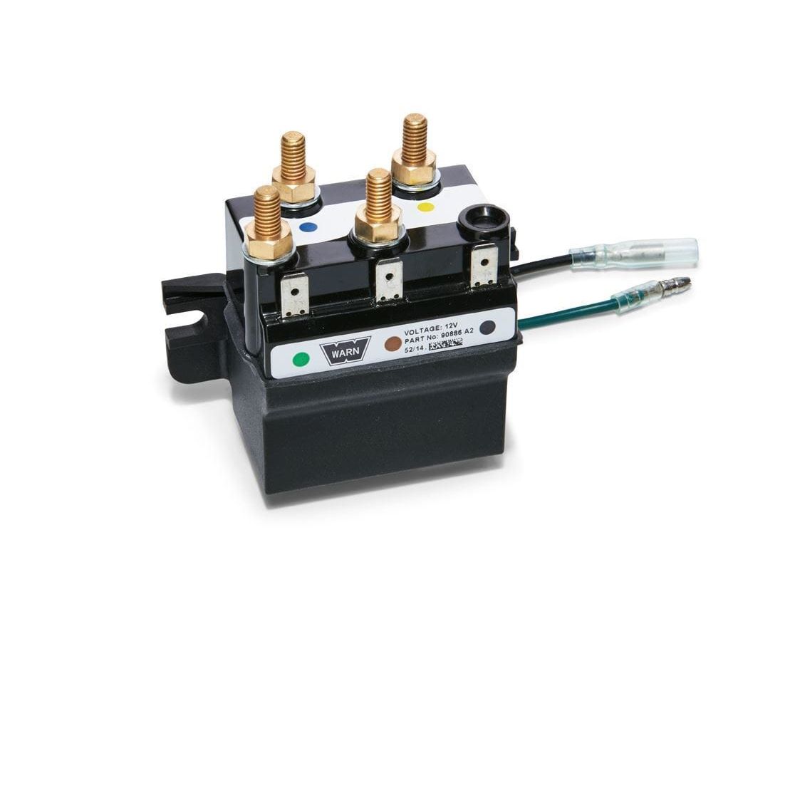 The Winch Replacement Contactor 4.0 by Warn is a black automotive relay/solenoid featuring four brass terminals, two electrical connectors, and a front label with voltage and part number information.