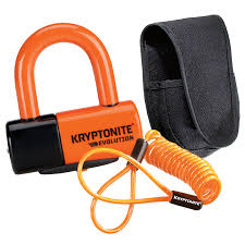 Orange disc lock with black base, black "Kryptonite" logo, orange coiled reminder cable, and black fabric pouch.