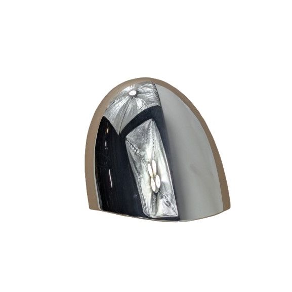 Chrome upper headlight bucket with smooth curved surface and polished finish.
