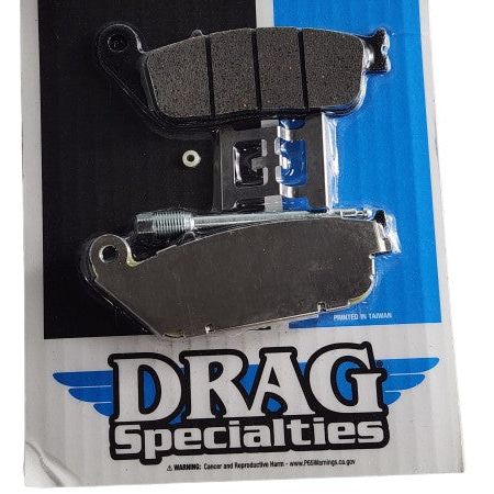 A package of Drag Specialties Semi-Metallic Rear Brake Pads with hardware, featuring semi-sintered pads on a blue, white, and black branded backing card.