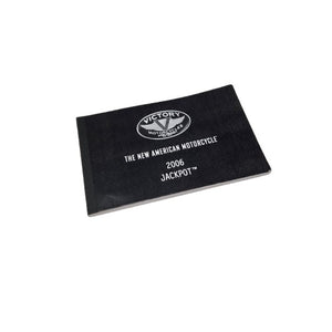 A black 06 VX Ness VX USA Owners Manual by Polaris, displayed on a white background—perfect for Victory motorcycle enthusiasts or those seeking OEM Victory Polaris parts.