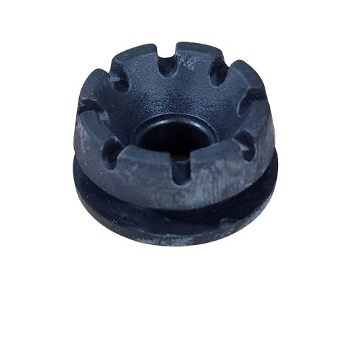 A close-up of a black, round Rubber Grommet by CF Moto sits on a rough beige surface. Evenly spaced notches are visible around its top edge, highlighting the OEM parts slotted design.