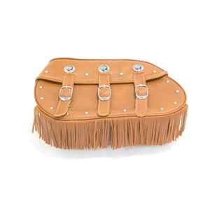 Tan leather soft saddlebag with three buckle straps, silver conchos, and fringe along the bottom edge.